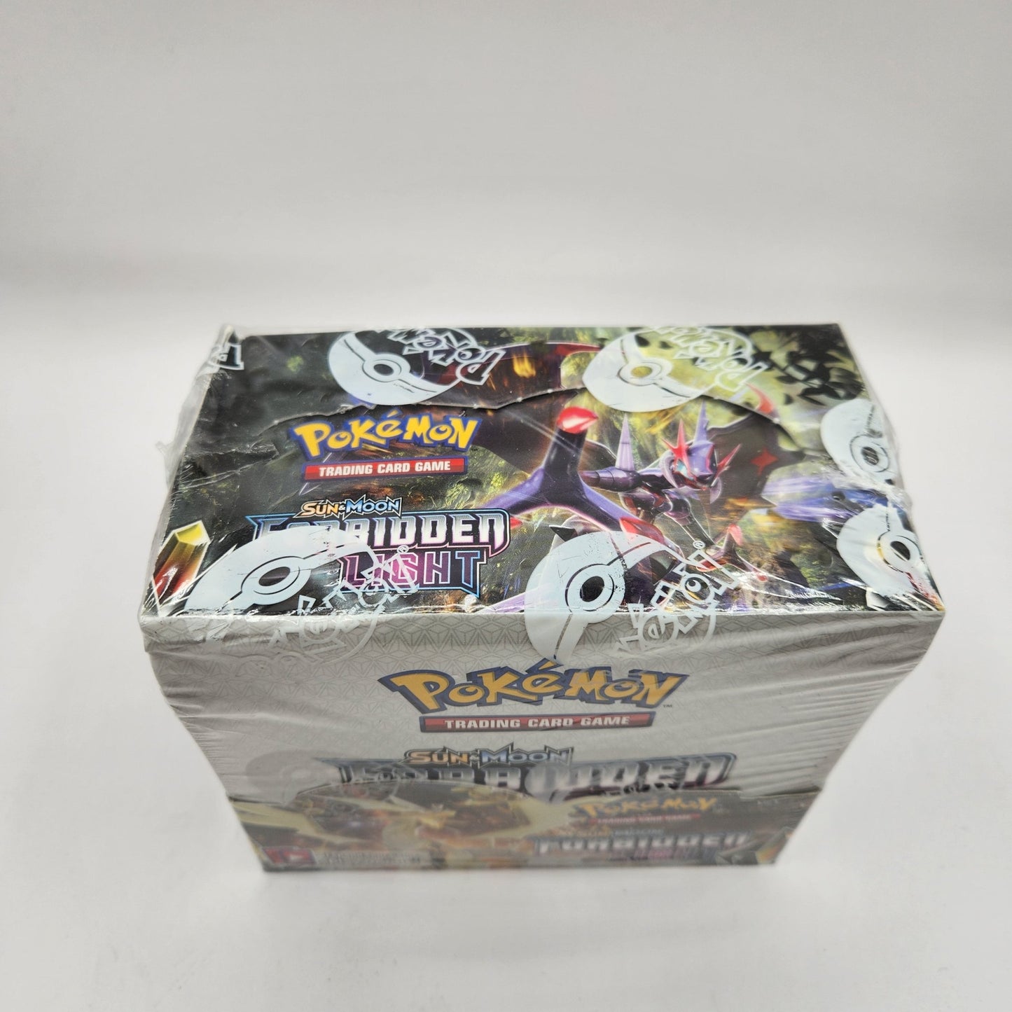 Pokemon: Sun & Moon Forbidden Light Booster Box *Dinged* - Collector Store LLC